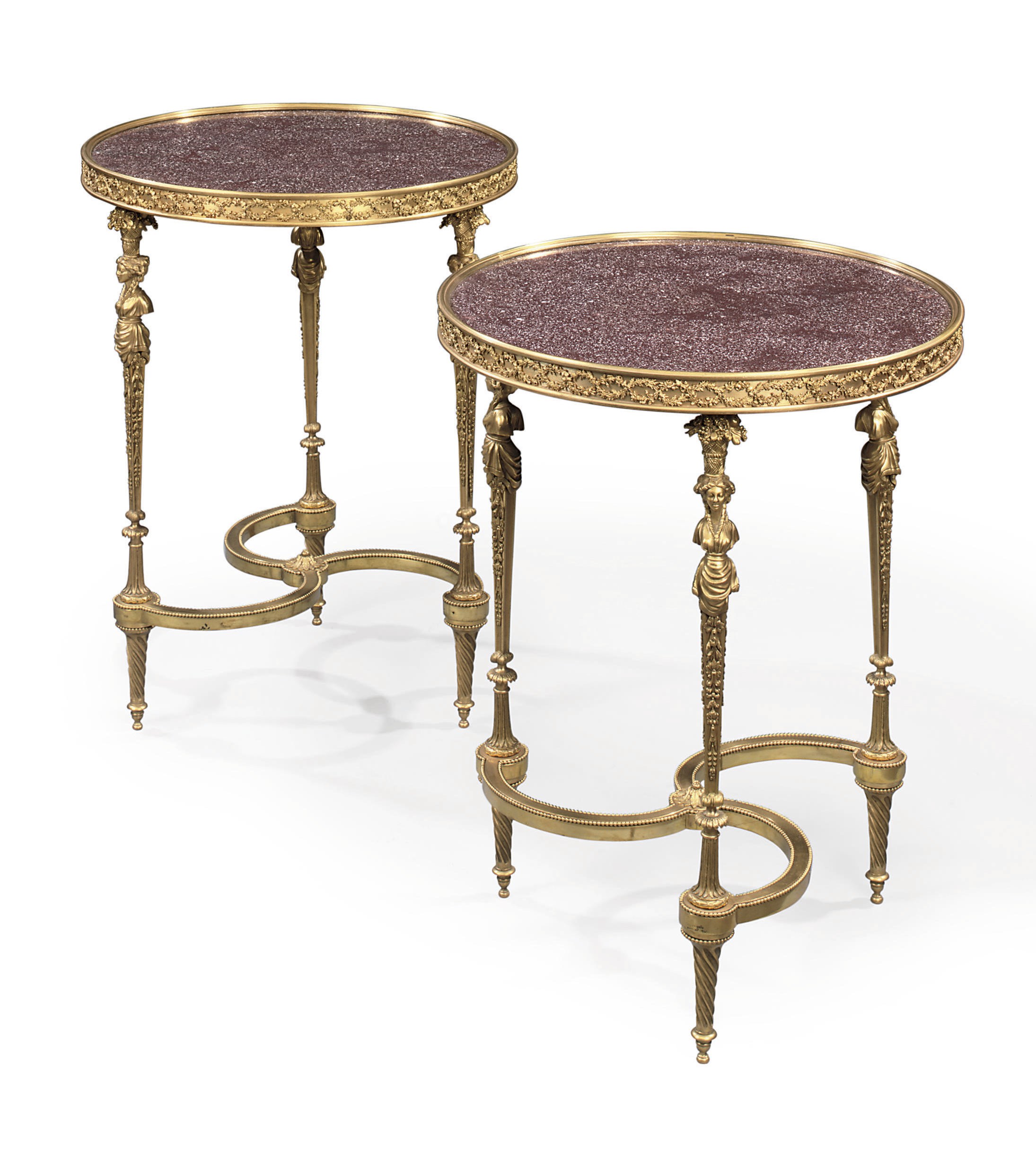 A PAIR OF FRENCH ORMOLU AND EGYPTIAN PORPHYRY GUERIDONS