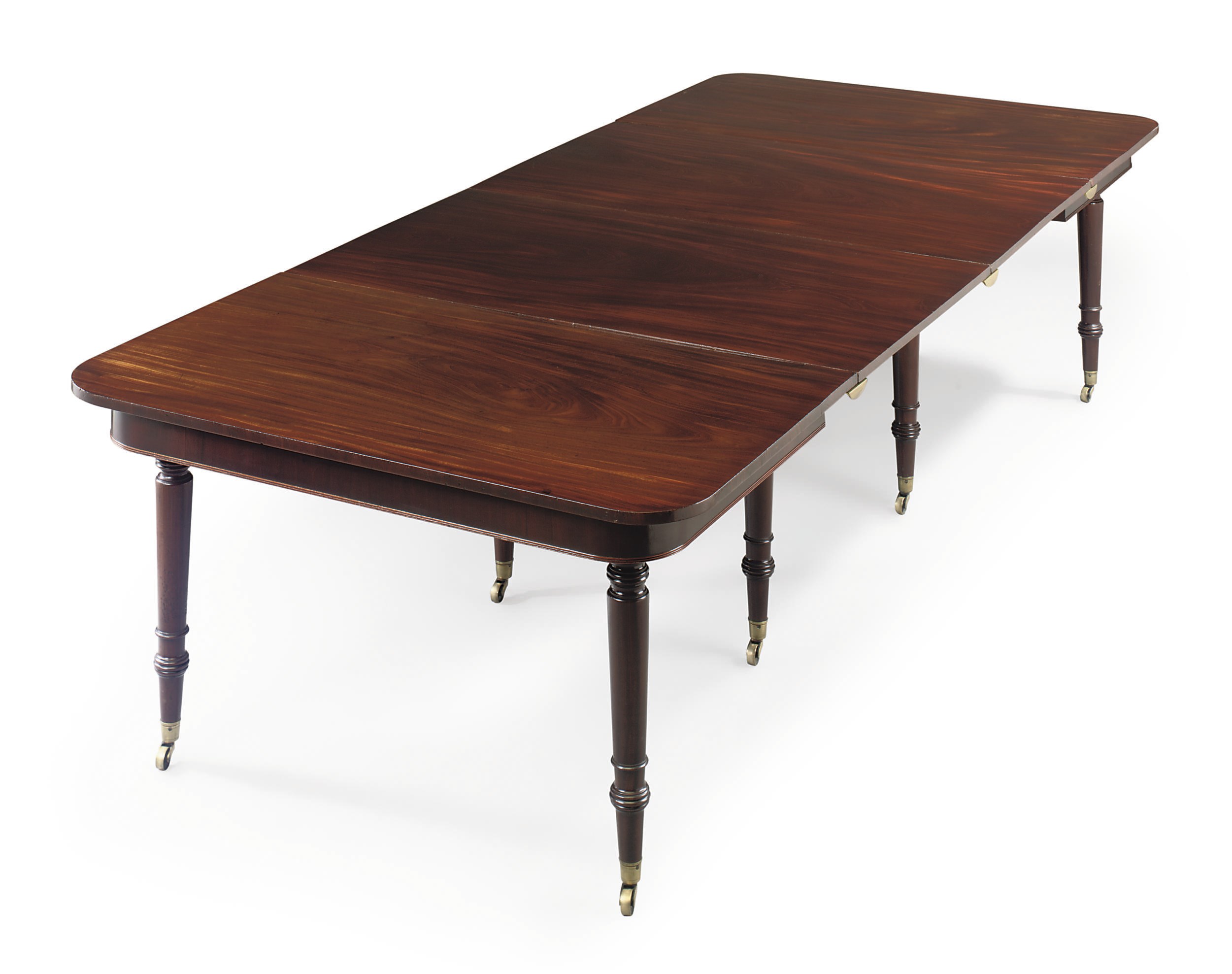 A REGENCY MAHOGANY EXTENDING DINING-TABLE