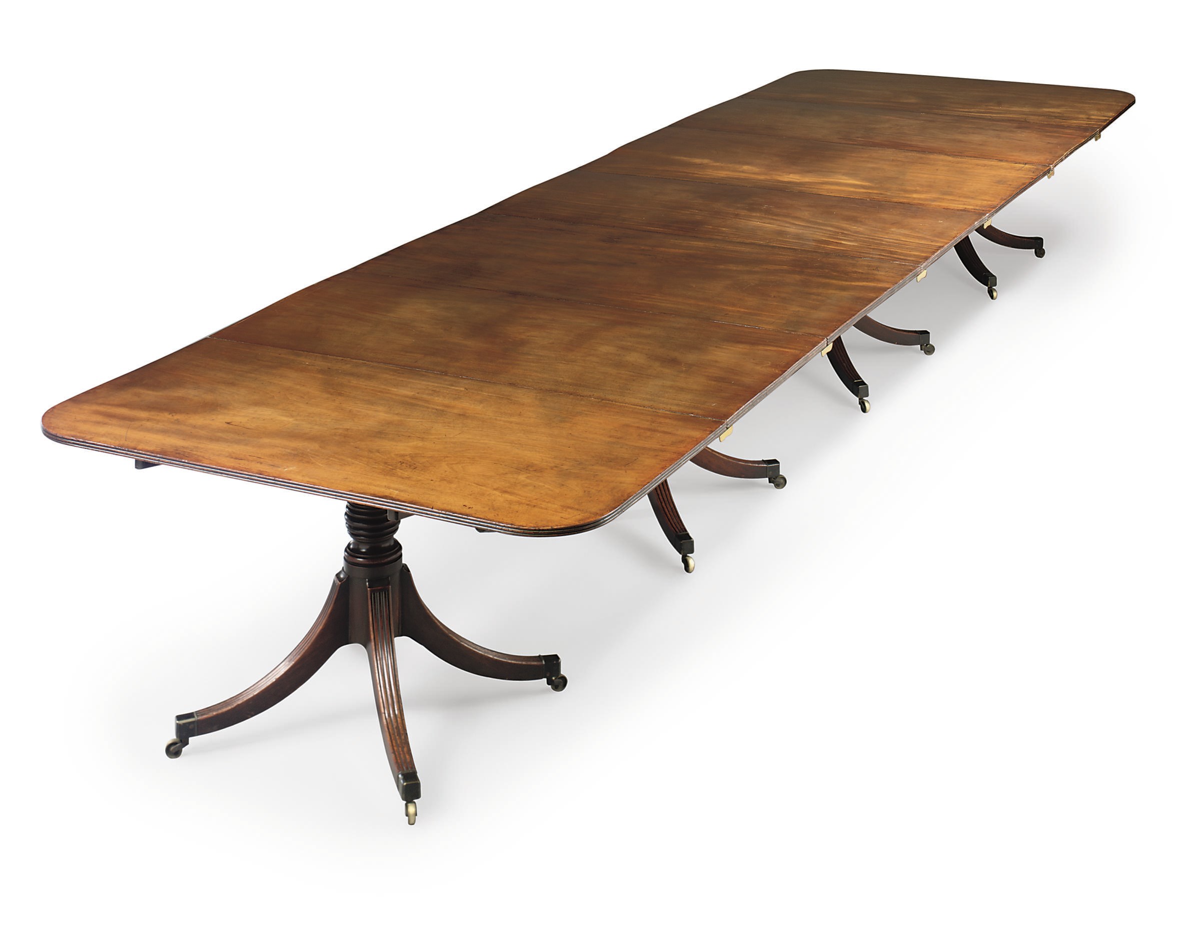 A REGENCY MAHOGANY FOUR-PEDESTAL DINING-TABLE