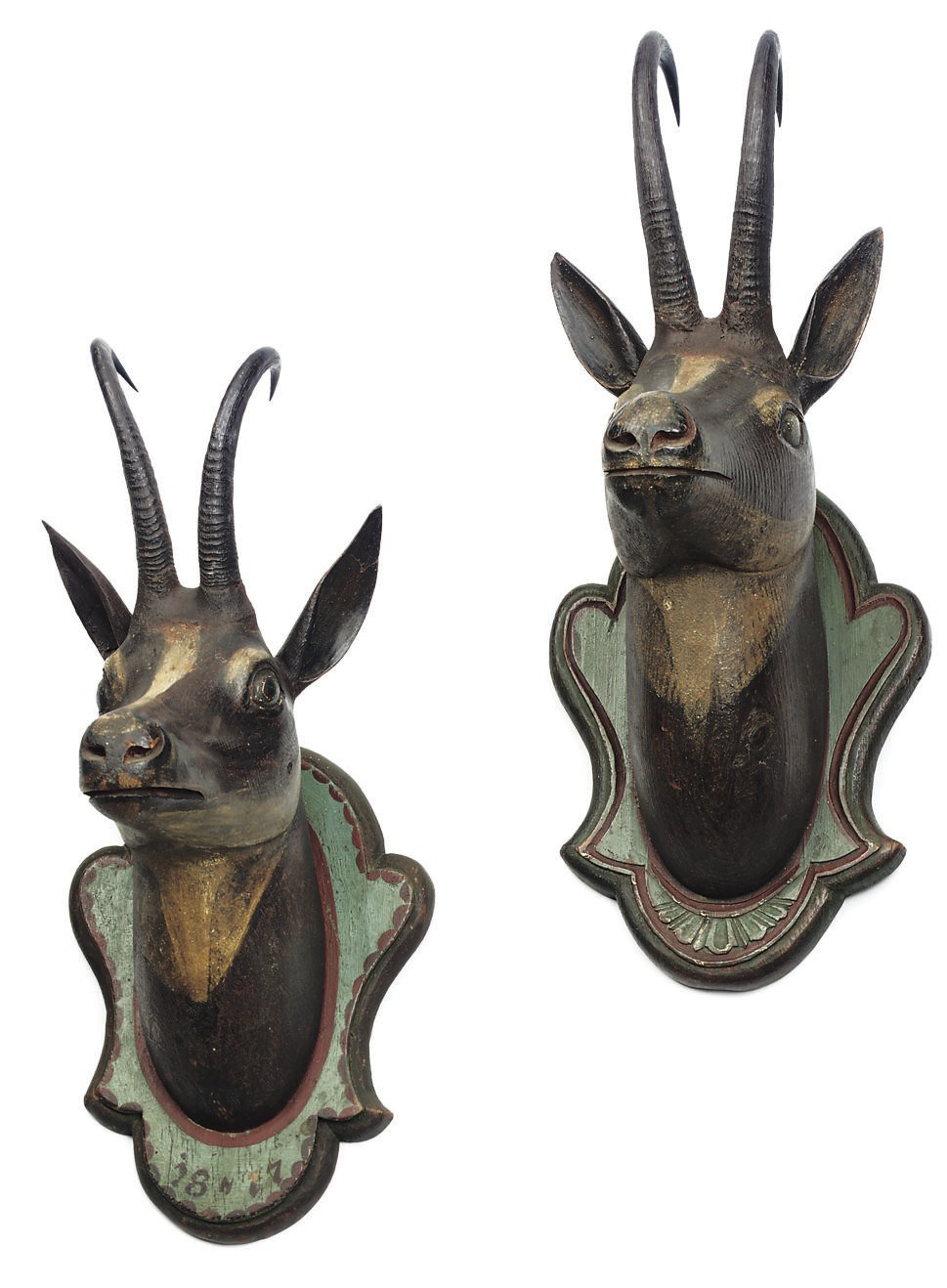 A PAIR OF AUSTRIAN POLYCHROME-DECORATED OAK CHAMOIS HEADS