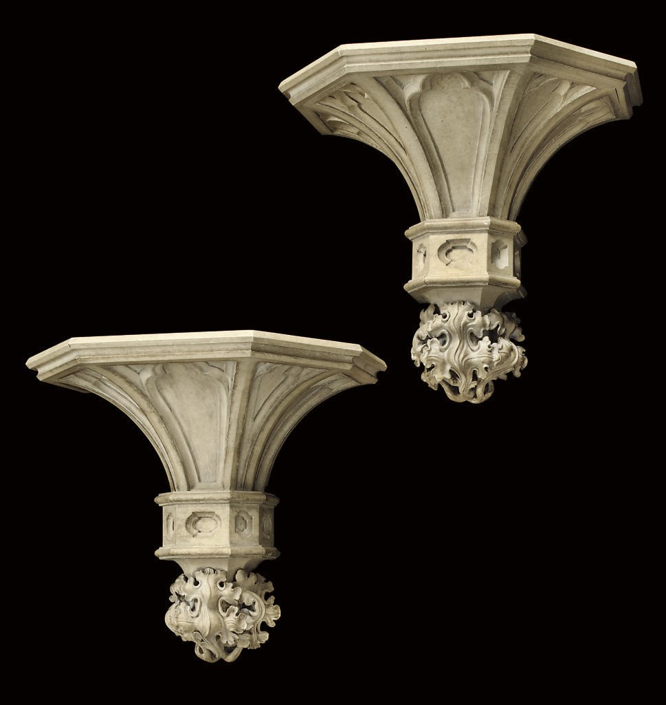 A PAIR OF SIMULATED STONE WALL BRACKETS
