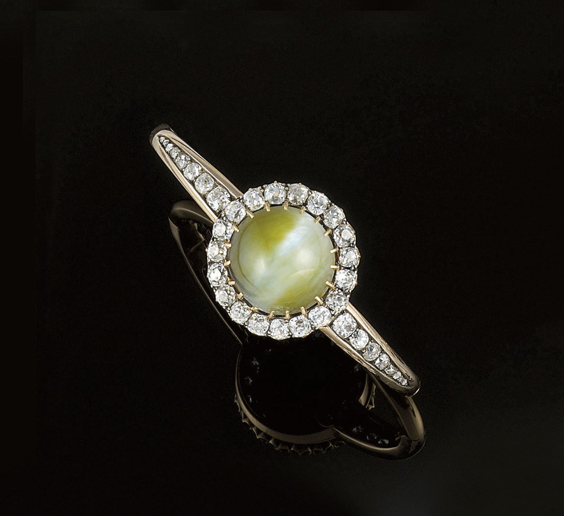 A late 19th century chrysoberyl cat's eye and diamond bangle