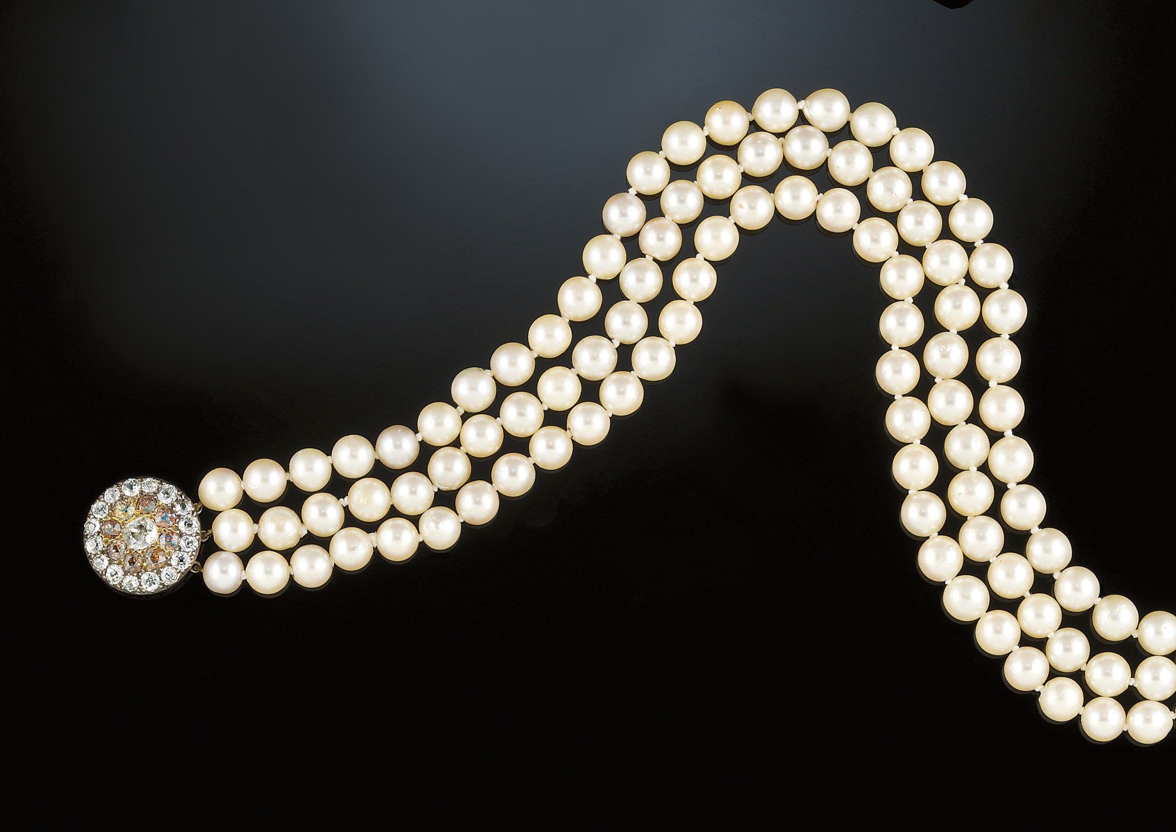 A diamond, coloured diamond and cultured pearl necklace