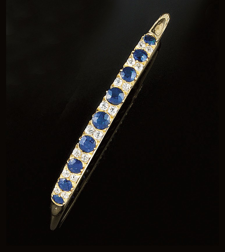 A late 19th/early 20th century sapphire and diamond bangle