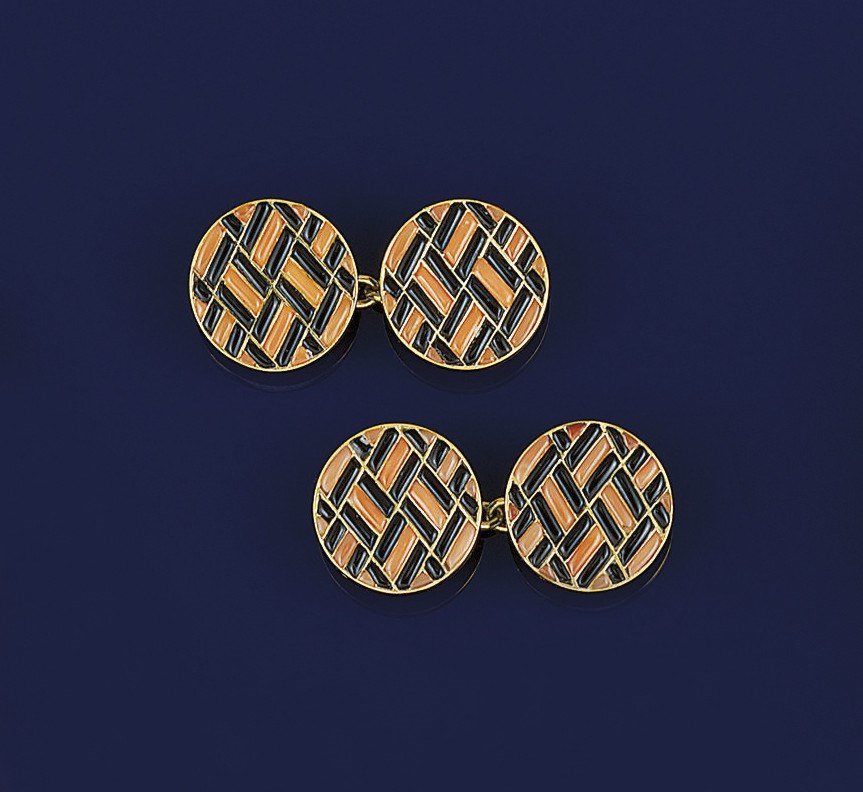 A pair of coral and onyx cufflinks