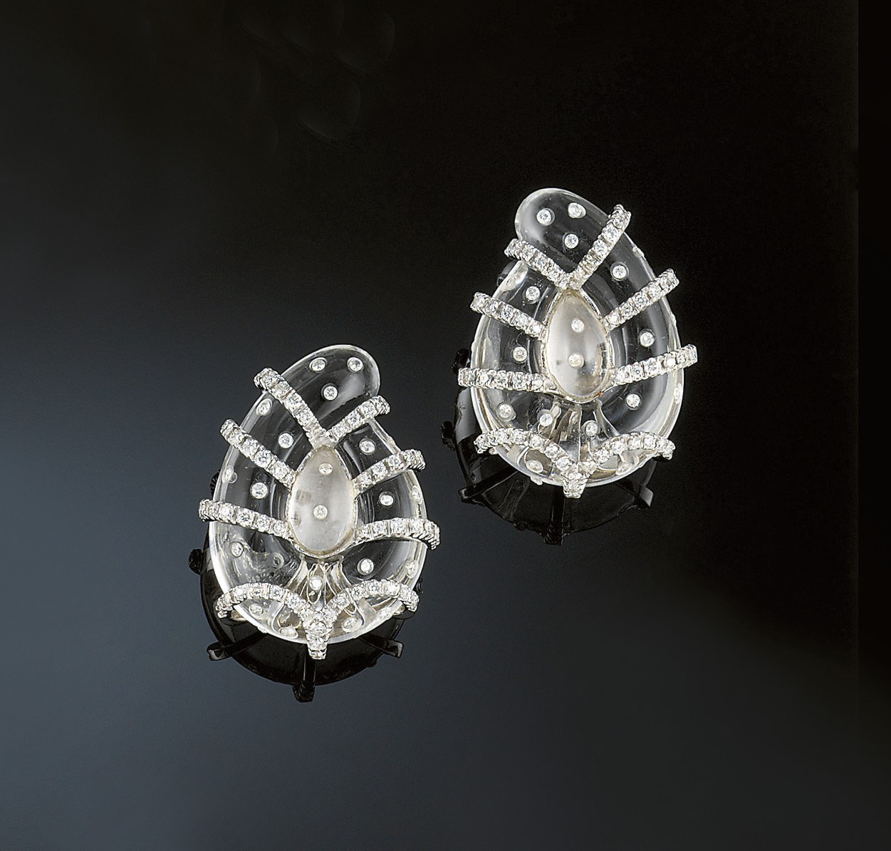 A pair of rock crystal and diamond earclips