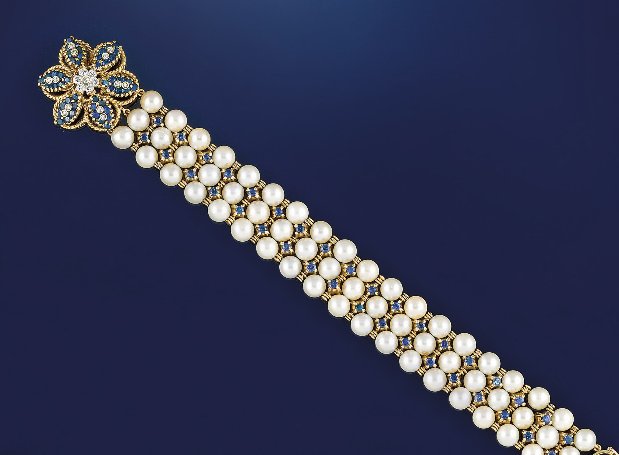 A cultured pearl, diamond and sapphire bracelet