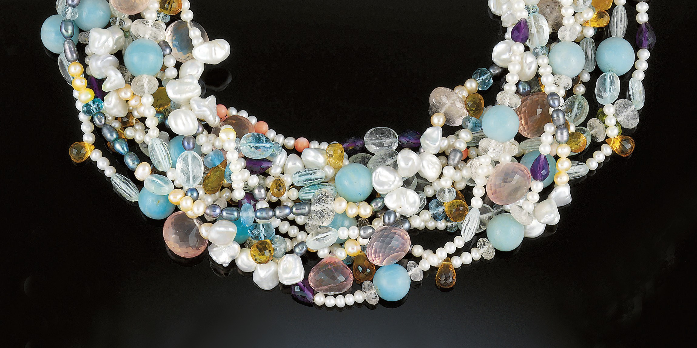 A gem and freshwater cultured pearl torsade necklace