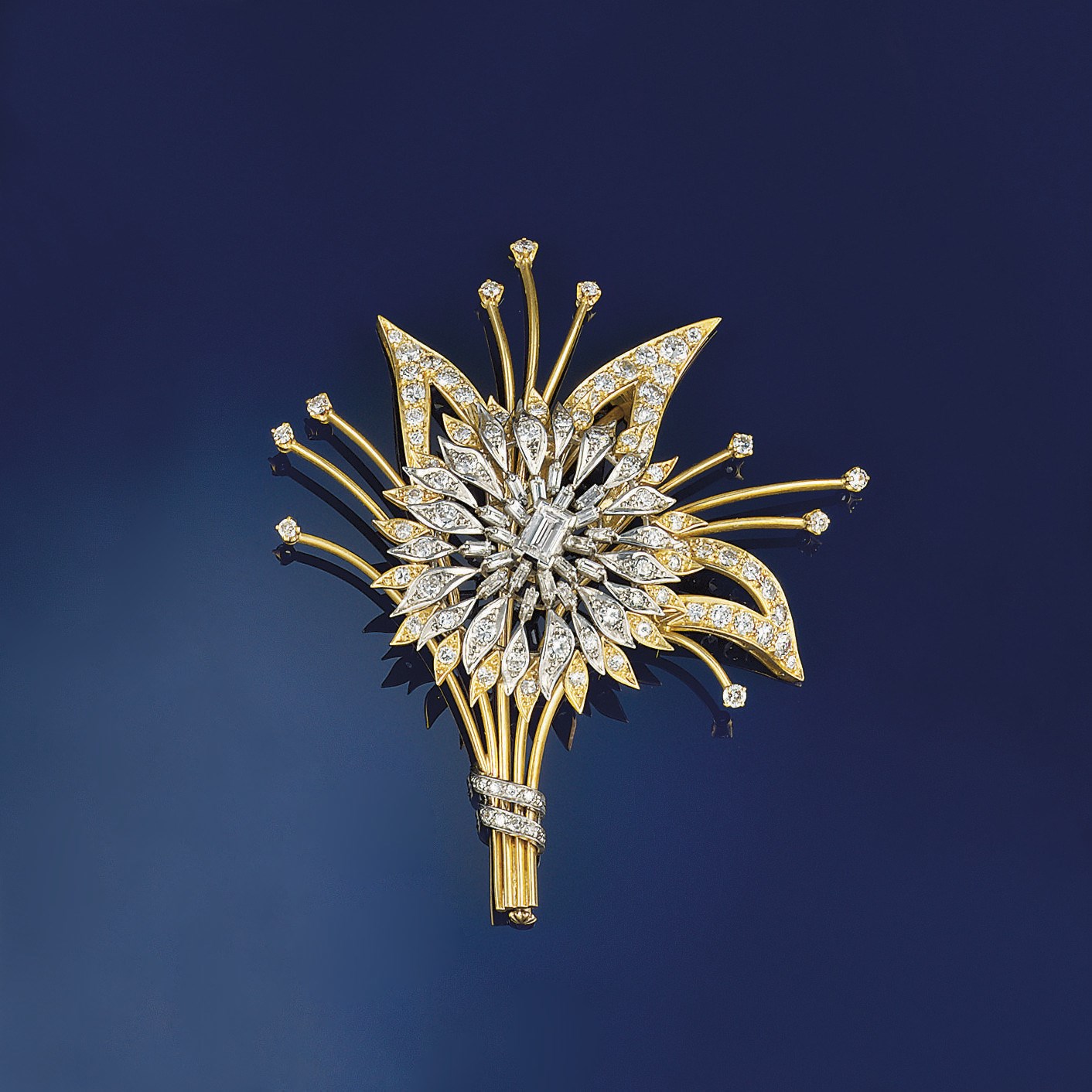A diamond brooch of floral spray design