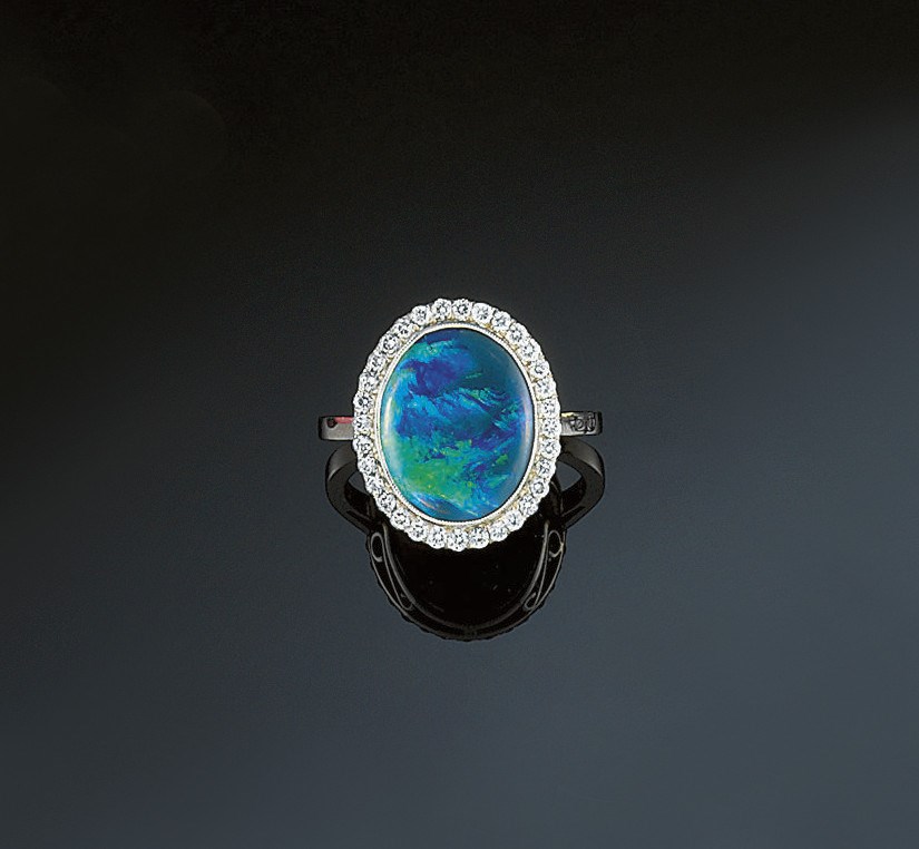 An opal and diamond ring