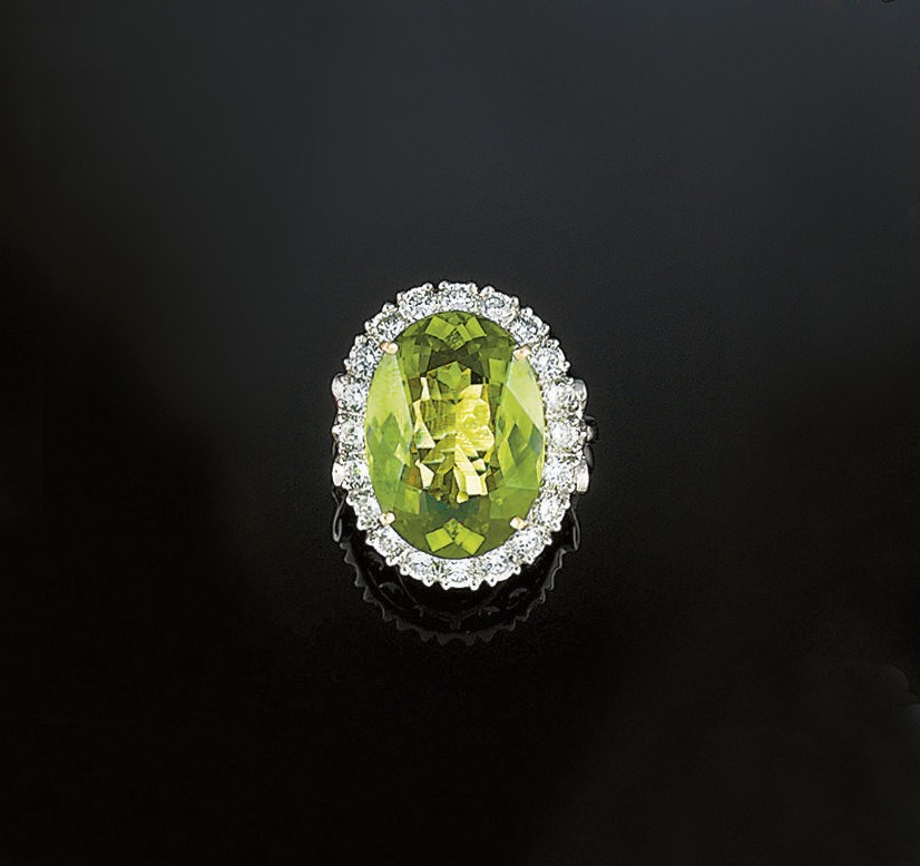 A peridot and diamond cluster ring
