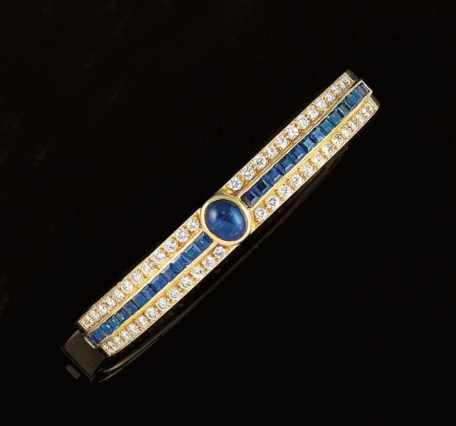 A SAPPHIRE AND DIAMOND BANGLE, BY GRAFF