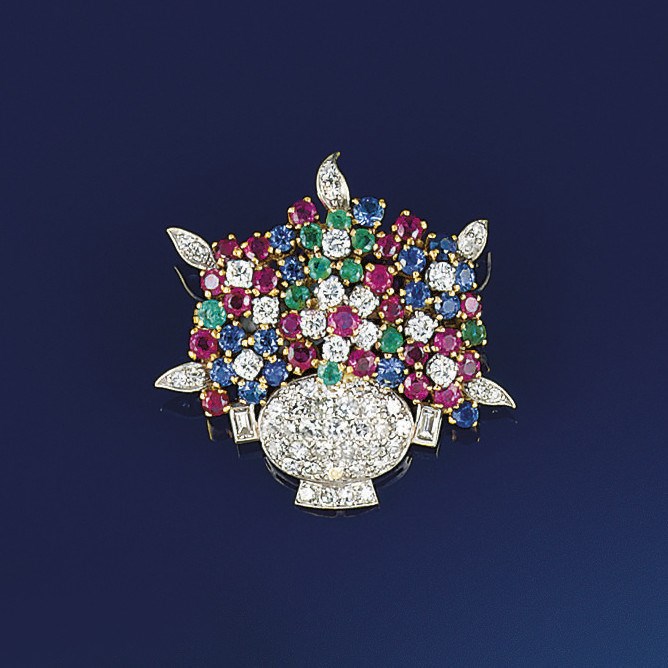 A diamond and gem brooch