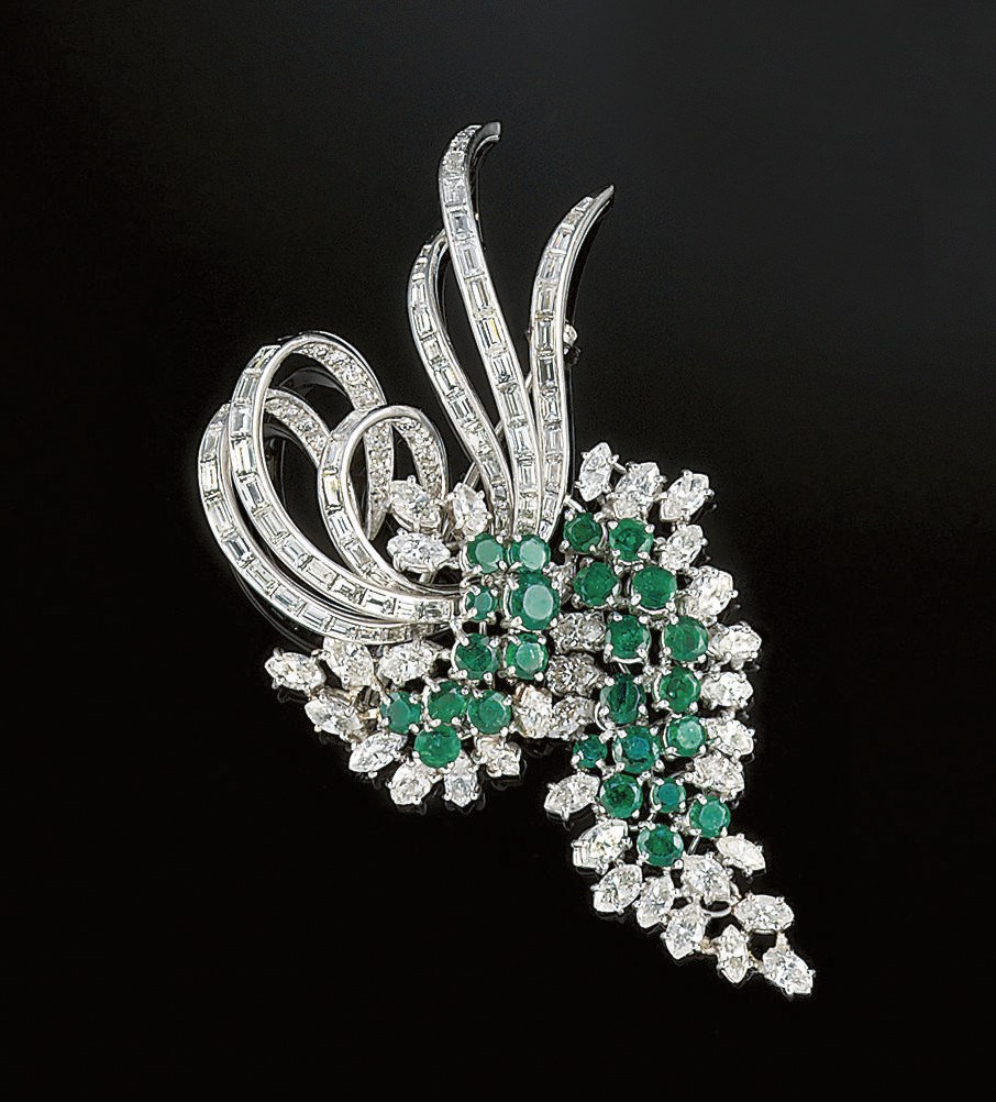 A diamond and emerald cluster brooch