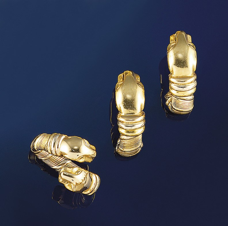 A pair of earclips and a ring, by Cartier