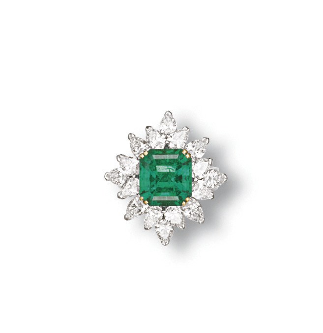 AN EMERALD AND DIAMOND RING