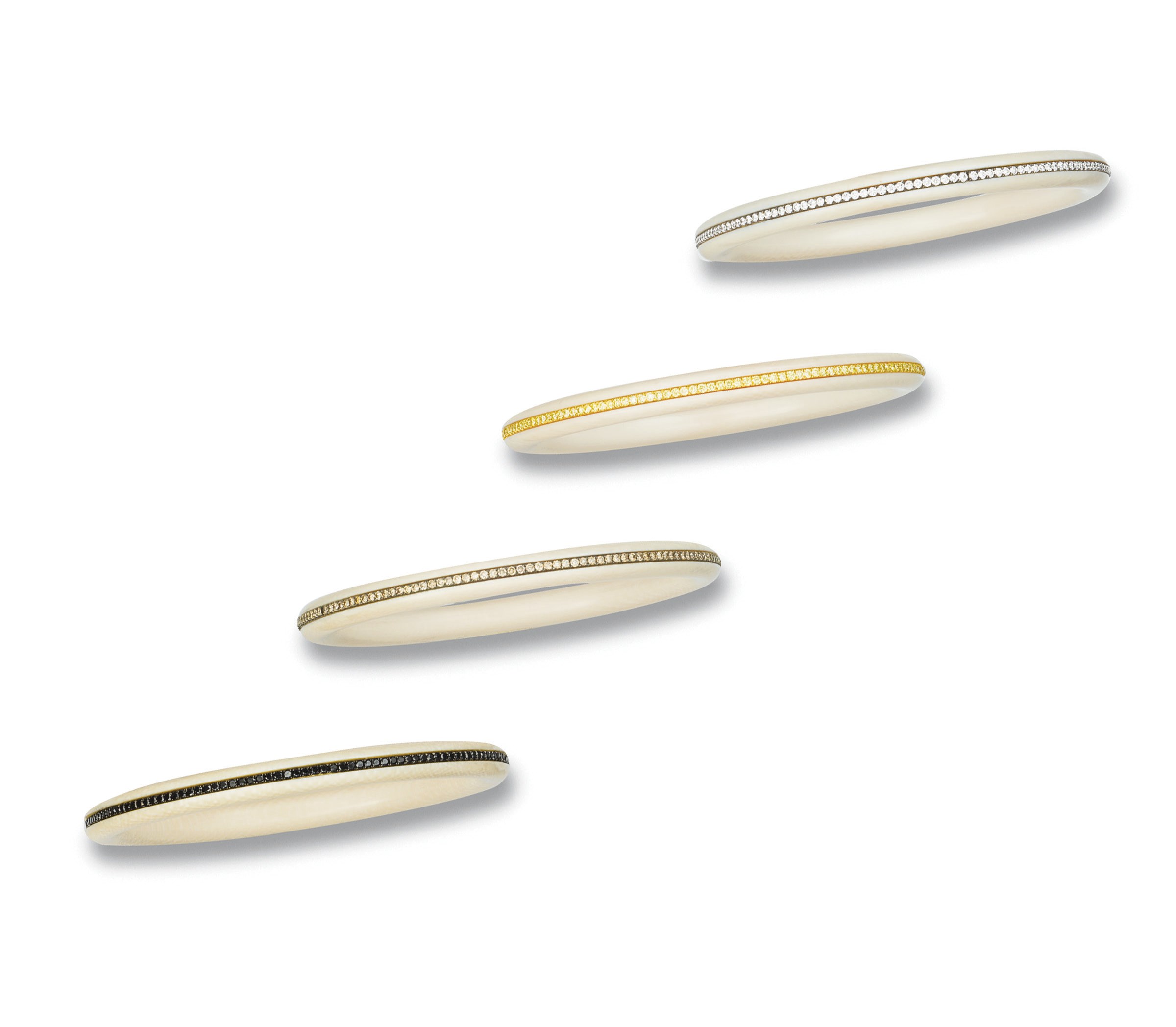**A SET OF IVORY AND COLOURED DIAMOND BANGLES