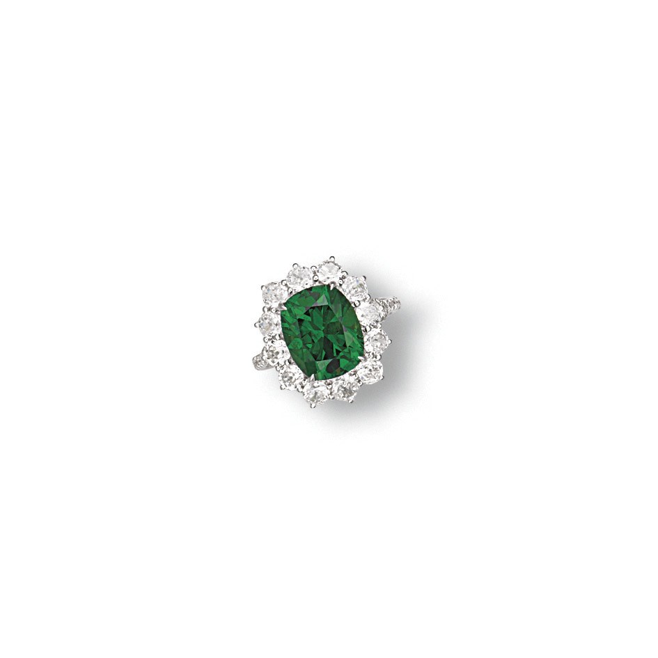 A DEMANTOID GARNET AND DIAMOND RING