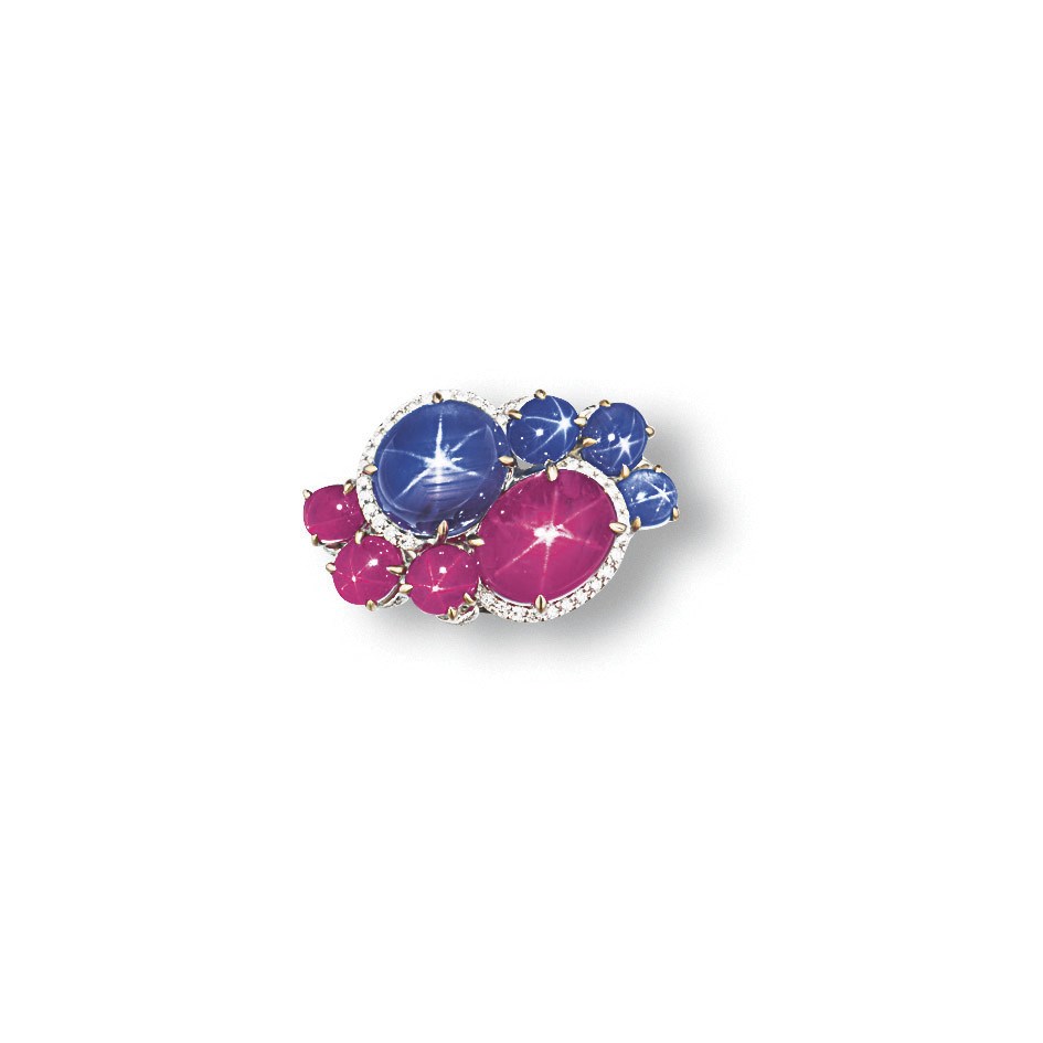 A STAR SAPPHIRE, STAR RUBY AND DIAMOND RING