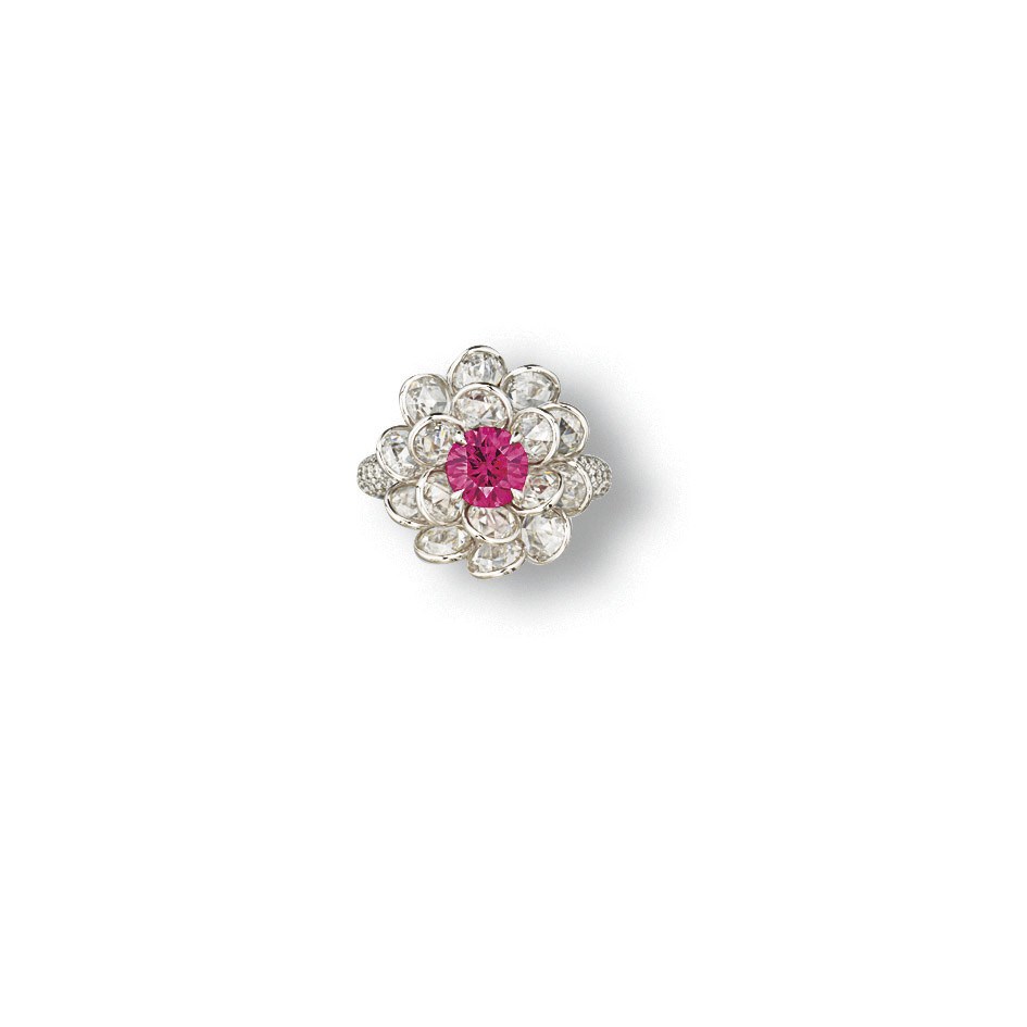 A RARE COLOURED DIAMOND AND DIAMOND RING