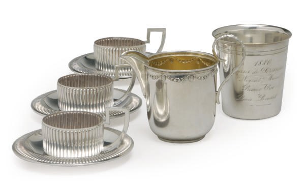 A SET OF TWELVE GERMAN SILVER GLASS HOLDERS AND SAUCERS,