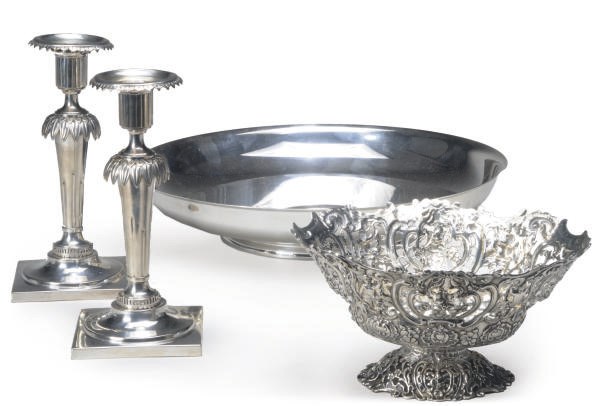 A PAIR OF GERMAN SILVER CANDLESTICKS AND A PIERCED SILVER CENTERBOWL,