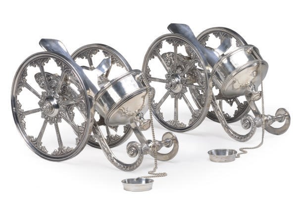A PAIR OF CONTINENTAL SILVER-PLATED BOTTLE WAGONS,