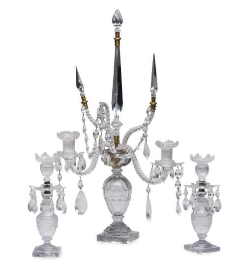 A CUT GLASS CANDELABRA AND A PAIR OF CANDLESTICKS,
