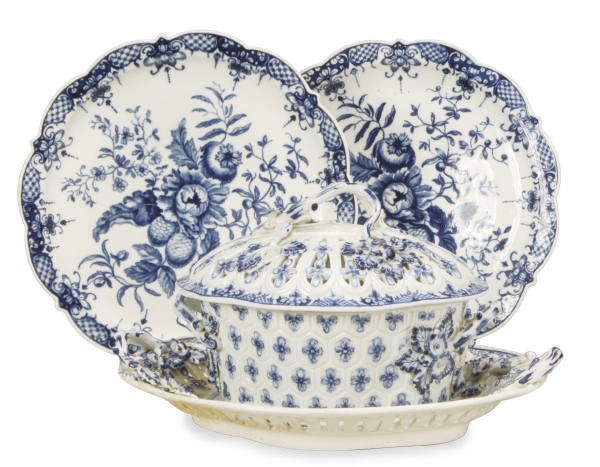 AN ENGLISH PORCELAIN BLUE AND WHITE CHESTNUT BASKET, PIERCED COVER AND STAND AND TWO ENGLISH PORCELAIN BLUE AND WHITE SHAPED PLATES,
