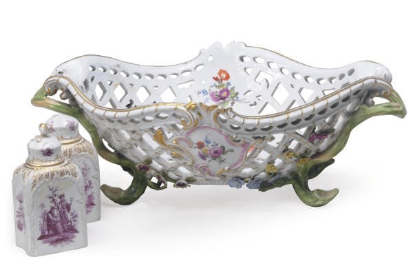 A GERMAN PORCELAIN RETICULATED BASKET AND A PAIR OF GERMAN PORCELAIN TEA CADDIES AND COVERS,
