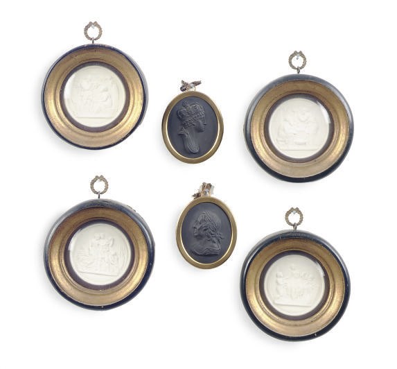 A PAIR OF ENGLISH BASALT OVAL PLAQUES,