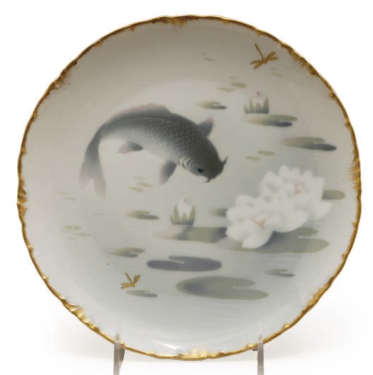 A SET OF TWELVE PORCELAIN PLATES WITH FISH DESIGNS,