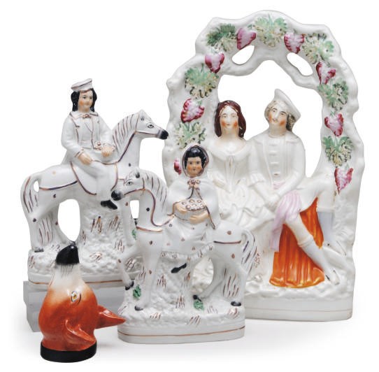 A GROUP OF THREE STAFFORDSHIRE FLATBACK FIGURES AND A STIRRUP CUP,