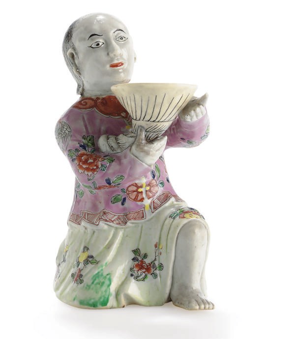 A CHINESE EXPORT FAMILLE ROSE FIGURE OF A KNEELING EUROPEAN,