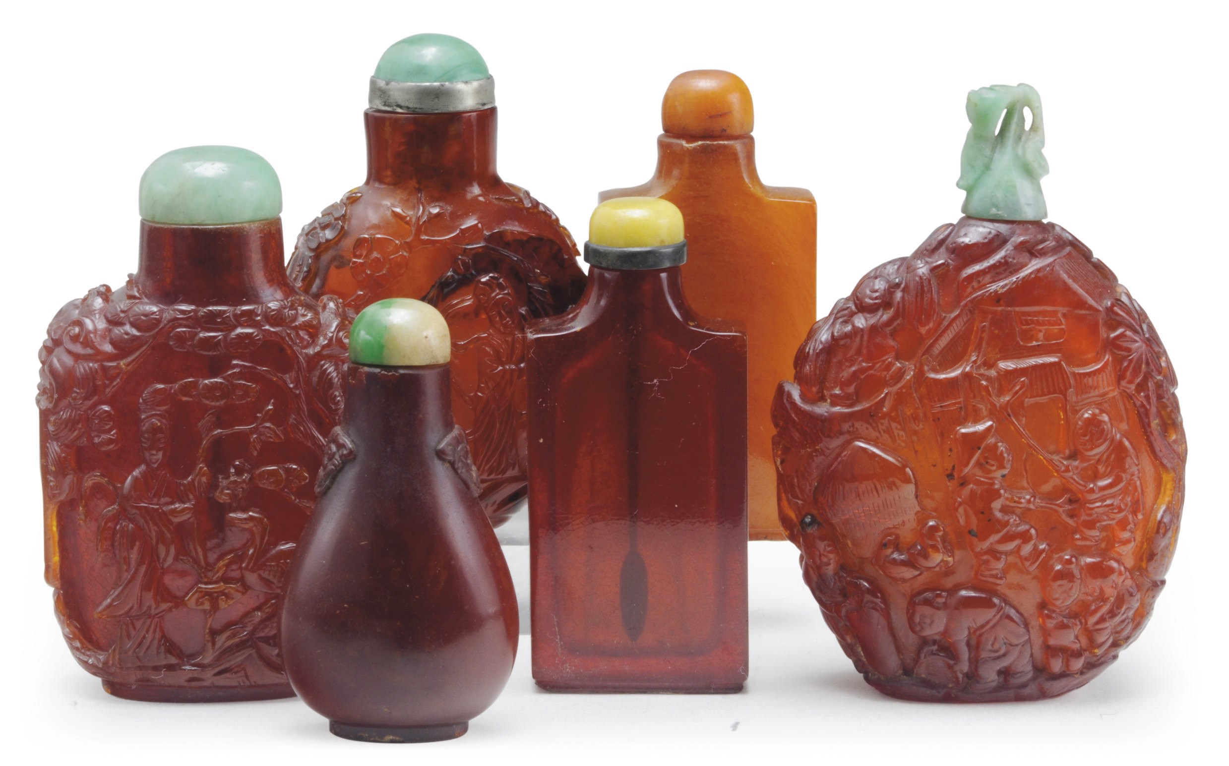 A GROUP OF SIX CHINESE CARVED AMBER SNUFF BOTTLES,**