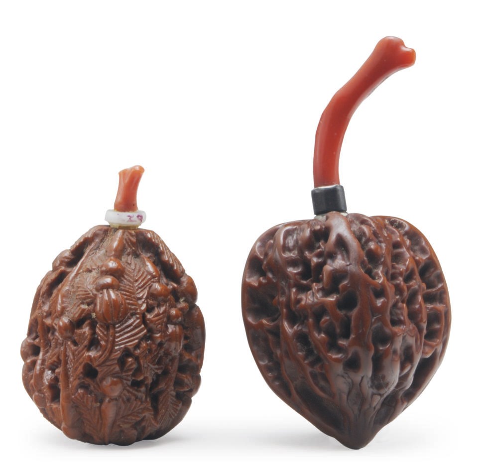 TWO CHINESE WALNUT SNUFF BOTTLES WITH CORAL BRANCH STOPPERS,