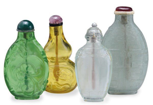 A GROUP OF FOUR CHINESE CARVED GLASS SNUFF BOTTLES,**