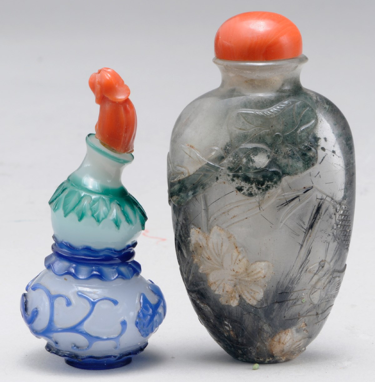 THREE CHINESE OVERLAY GLASS SNUFF BOTTLES,**