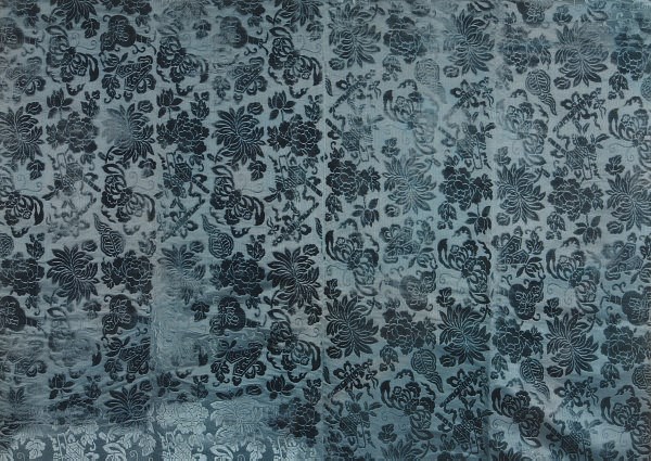 A CHINESE SILK VOIDED VELVET BLUE GROUND PANEL,