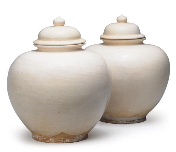 A PAIR OF LARGE TANG-STYLE WHITE-GLAZE POTTERY JARS AND COVERS,