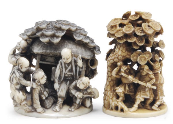 TWO JAPANESE IVORY NETSUKE CARVED WITH FIGURES BENEATH TREES,**