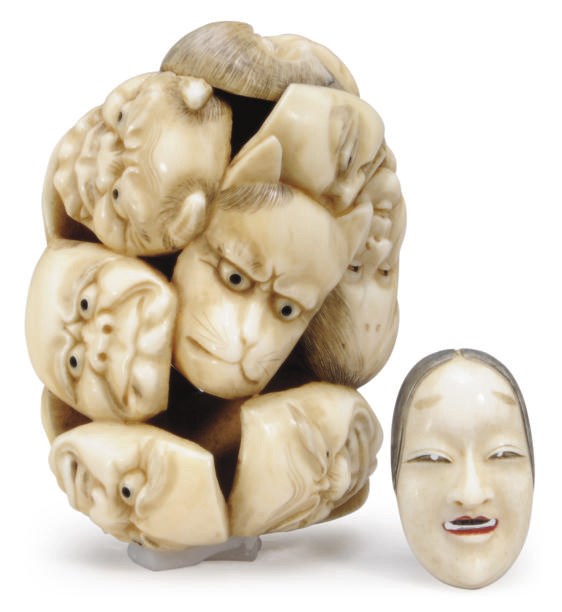 A JAPANESE IVORY CARVING OF A MASK GROUP AND A NETSUKE MASK,**