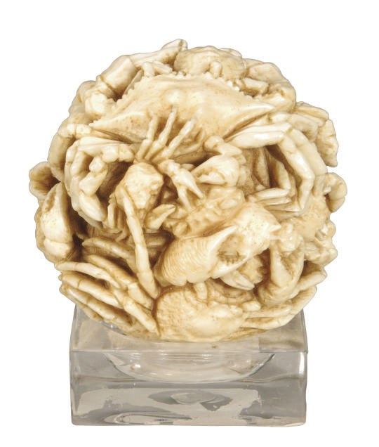 A JAPANESE IVORY TABLE ORNAMENT CARVED WITH CRABS,**