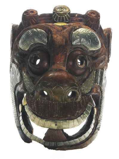 A TIBETAN WOOD AND METAL MOUNTED SNOW LION MASK,