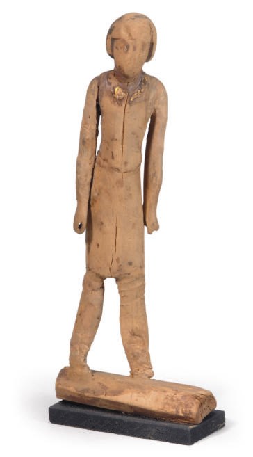 AN EGYPTIAN WOOD FIGURE OF A MAN