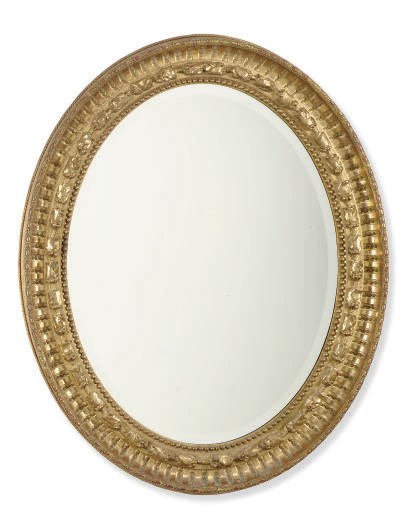 AN ENGLISH GILTWOOD OVAL MIRROR,
