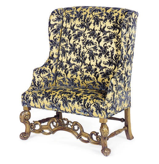 A WALNUT AND UPHOLSTERED SETTEE,