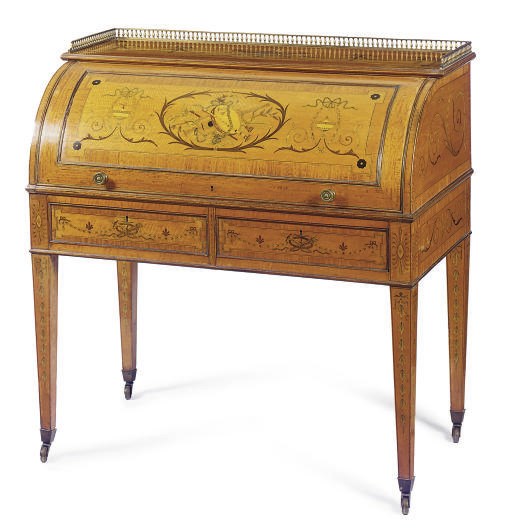 AN EDWARDIAN SATINWOOD, HAREWOOD, AND MARQUETRY CYLINDER DESK**,