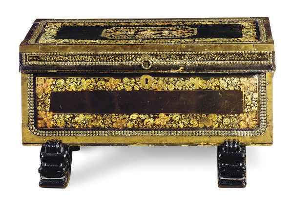 A BRASS-MOUNTED POLYCHROME-DECORATED LEATHER TRUNK,