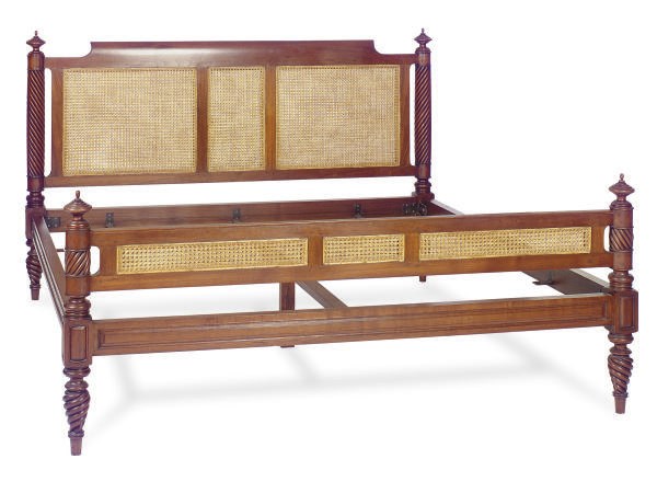 A COLONIAL HARDWOOD AND CANED BED,